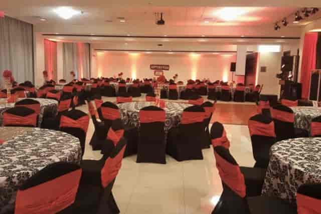 Elegant banquet hall in India House with black and white decor, perfect for events.