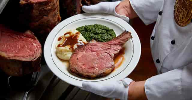 Gourmet prime rib dinner at Lawry's The Prime Rib Dallas, ideal for upscale events.
