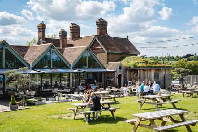 Charming outdoor venue with rustic shacks, perfect for corporate retreats and casual gatherings.