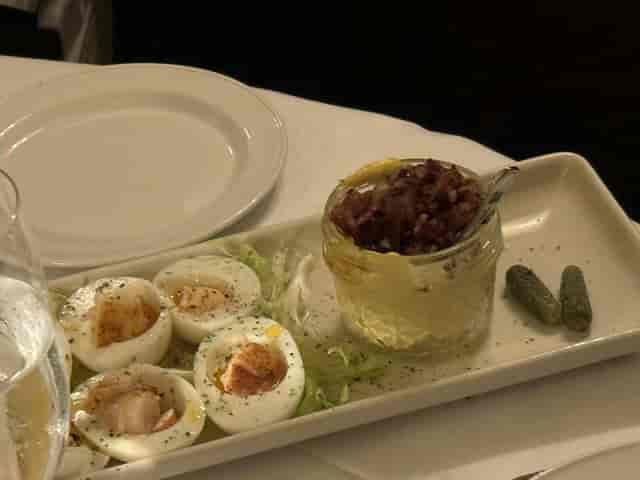 Elegant appetizer with eggs and pâté in The Wine Room, Pappas Bros. Steakhouse event.