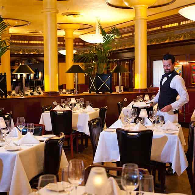 Wine tasting event at Pappas Bros. Steakhouse, elegant decor and upscale atmosphere.