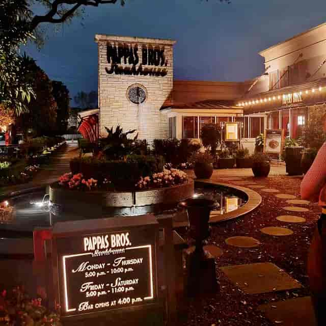 Wine tasting event at Pappas Bros. Steakhouse with elegant outdoor ambiance.