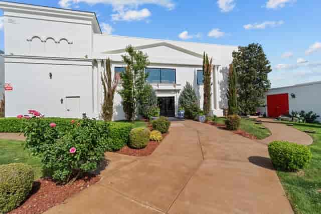 Modern event venue in Dallas with landscaped gardens, perfect for weddings and meetings.