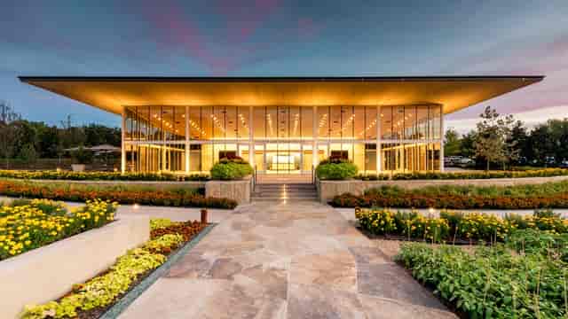 A Tasteful Place in Dallas Arboretum featuring a modern glass facade for weddings and events.