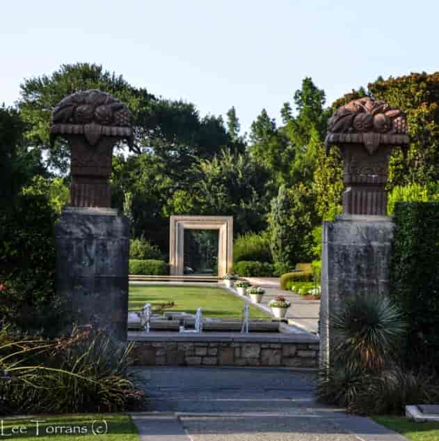Elegant garden entrance with stone pillars at Dallas Arboretum—perfect for weddings and events.