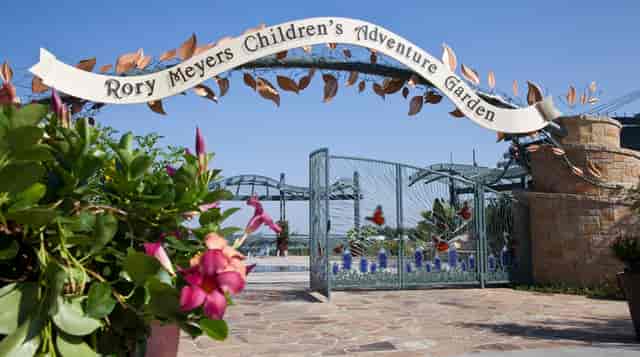 Children's Adventure Garden entrance, vibrant flora, family-friendly events, outdoor gatherings