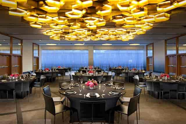 Elegant event space in W Dallas with round tables for receptions and formal dinners.