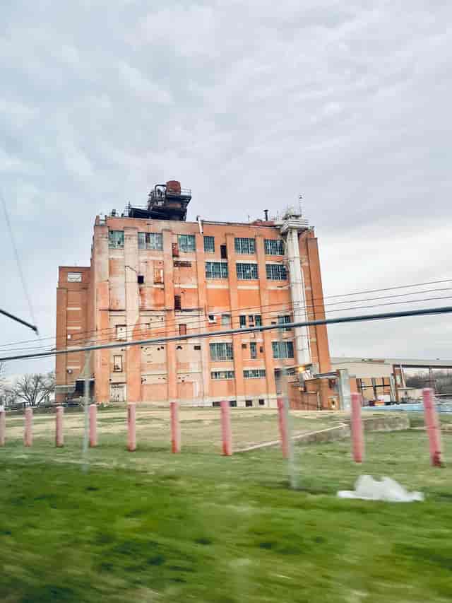 Industrial venue with rugged exterior ideal for creative events and art installations.