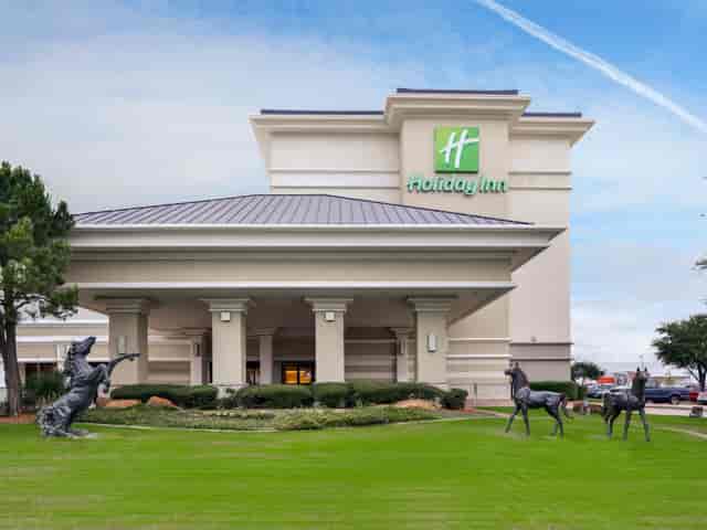 Holiday Inn Dallas-Richardson conference venue with landscaped grounds for events.