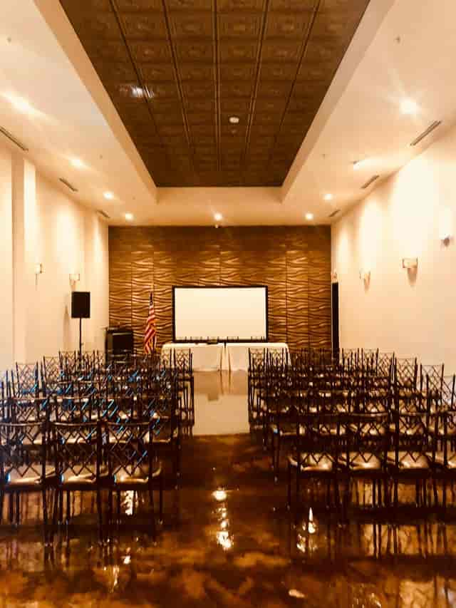 Breakout room setup with black chiavari chairs for a professional event presentation.