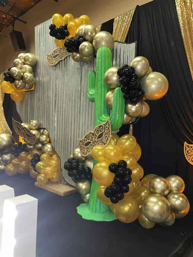 Cactus-themed event setup with elegant balloon decor at Vouv Event Space.