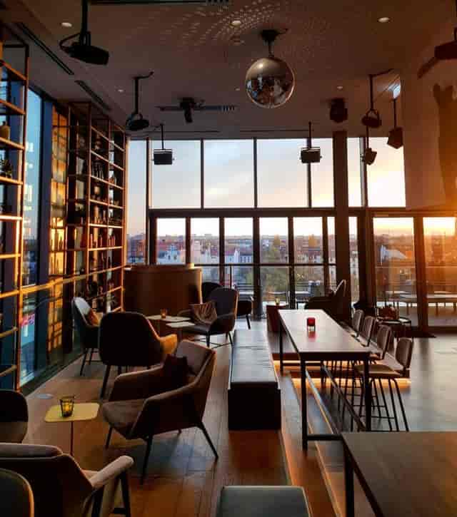 Gallery Rooftop Lounge with sunset view, perfect for meetings and social events.