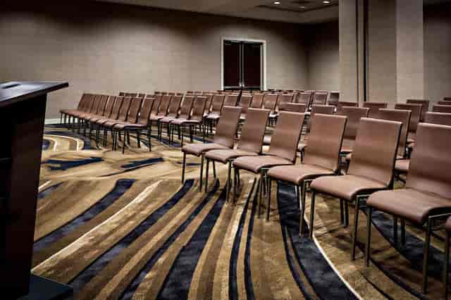Modern meeting space with elegant chairs at Worthington Renaissance Hotel for seminars.