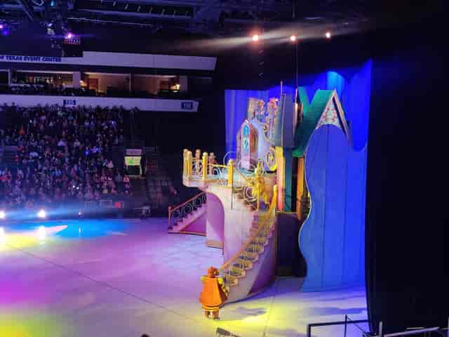 Vibrant stage with colorful backdrop at Credit Union of Texas Event Center for live performance.