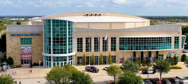 Modern convention center with glass facade, ideal for corporate events in Texas.