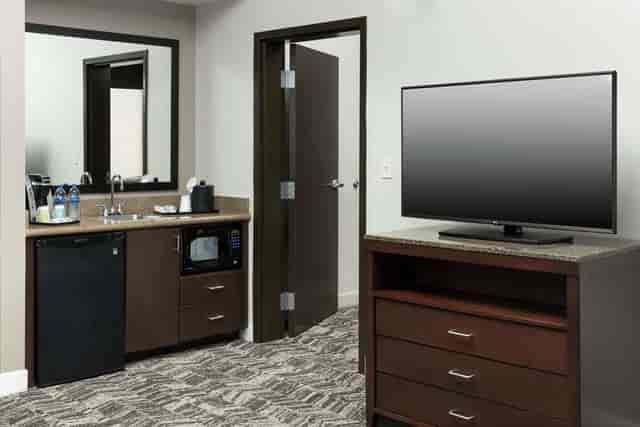 Hilton Garden Inn DFW Grapevine hotel room with kitchenette, perfect for meetings and events.