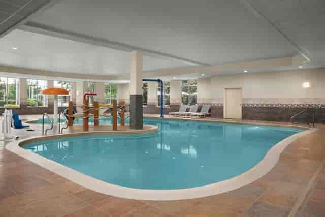 Indoor pool at Hilton Garden Inn Fort Worth, ideal for networking events and relaxation.