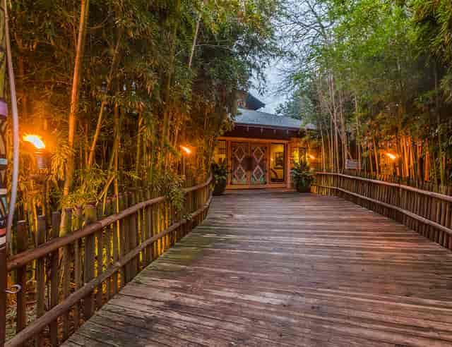 Portraits of the Wild gallery entrance with bamboo torches for events in Fort Worth Zoo.