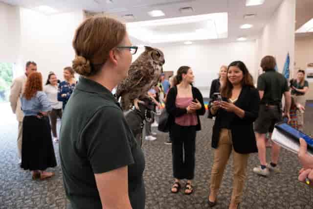 Networking event at Fort Worth Zoo with owl attraction, fostering engagement and creativity.