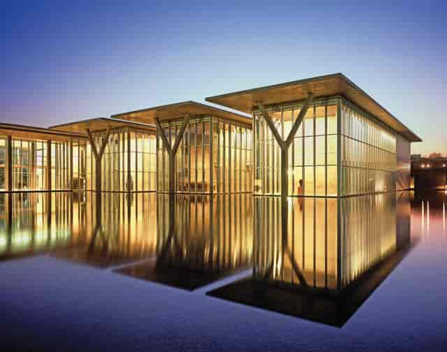 Modern Shop venue with sleek architecture and glass windows for corporate events.