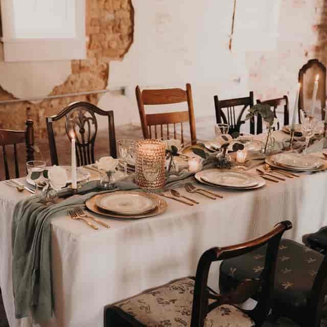 Elegant wedding table setup at Historic Dallas Jail with polished glassware and candles.