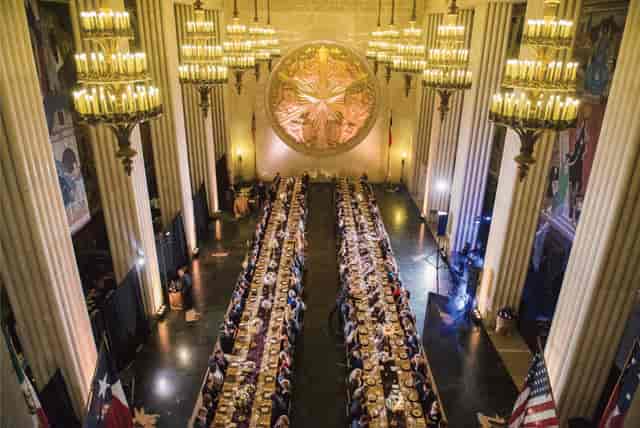 Elegant banquet hall in Texas Rooms, opulent chandeliers, perfect for formal events.