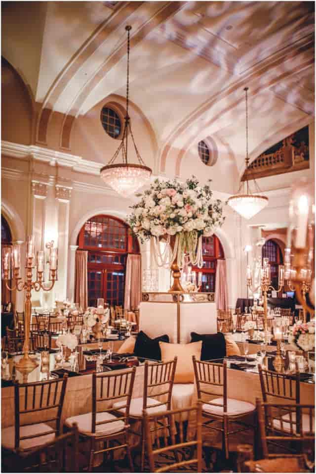 Elegant event space in AMA Houston with tall floral centerpieces for weddings and corporate events.