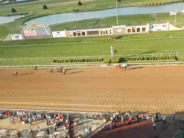 Vibrant horse racing event at Lone Star Park with expansive racetrack for gatherings.