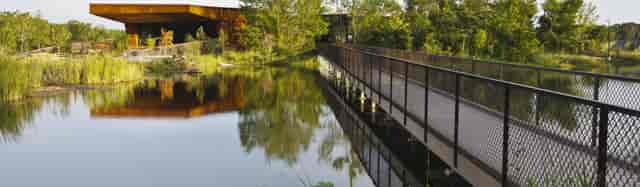 Trinity River Audubon Center: serene visitor center with lush greenery for outdoor events.
