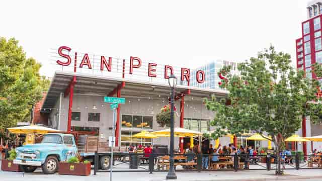 Peralta Plaza outdoor venue with colorful umbrellas, perfect for summer gatherings and events.