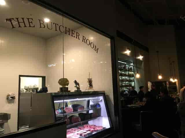 Chic bar in Alexander's Steakhouse with premium meats; ideal for corporate events.