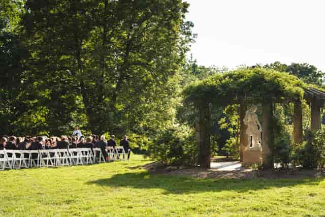 Diana at Biltmore: elegant outdoor wedding setup with gazebo and lush greenery.