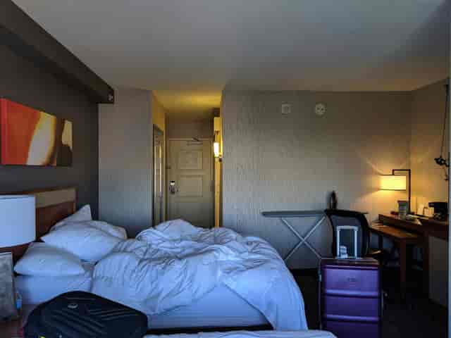 San Jose Marriott ballroom with unmade bed, ideal for business and events.