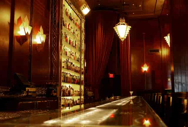 Stylish Redwood Room cocktail bar with illuminated counter for elegant events.