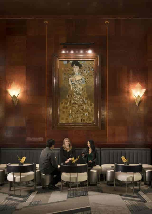 Intimate lounge with warm wood decor, perfect for networking events and meetings.