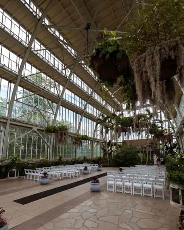 Jewel Box venue with glass walls and lush greenery, perfect for weddings and retreats.