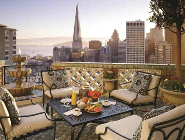 Elegant Empire Room at Fairmont SF with city skyline, ideal for upscale events and meetings.