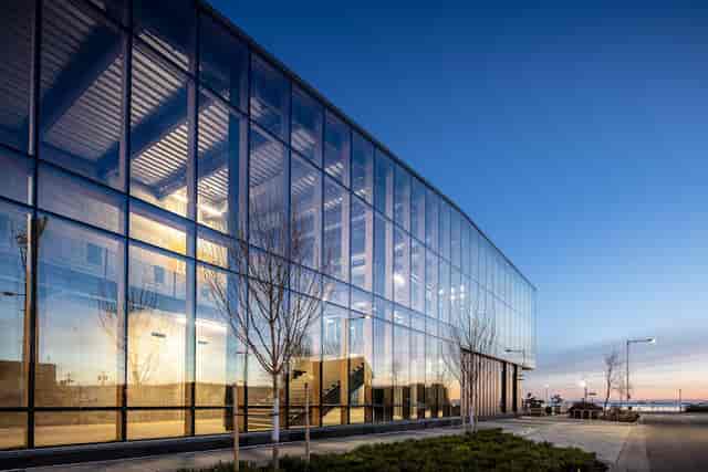 Modern glass-fronted venue at Sunset Lounge, ideal for corporate events and waterfront views.