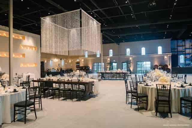 Elegant ballroom with round tables, perfect for weddings and corporate events.
