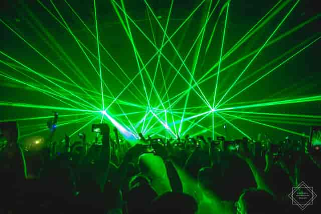 Amusement center with dynamic green lasers, ideal for concerts and live events.