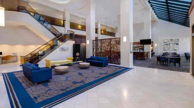 Spacious conference room with modern decor at Embassy Suites Santa Clara for events.
