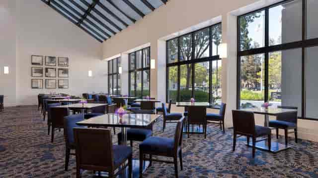 Conference room at Embassy Suites Santa Clara with natural light for meetings and events.