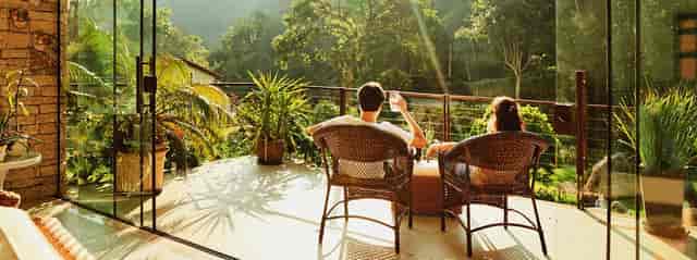 Back patio retreat in Urban Sanctuary San Jose with cozy seating and lush greenery.