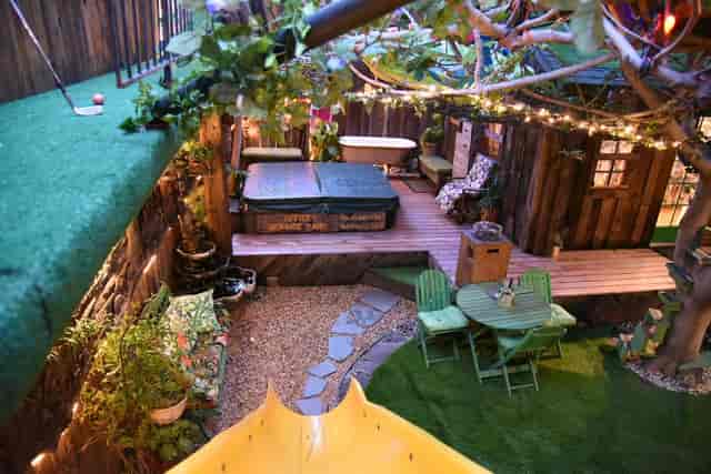 Charming outdoor venue with cozy seating and hot tub, perfect for retreats in San Jose.