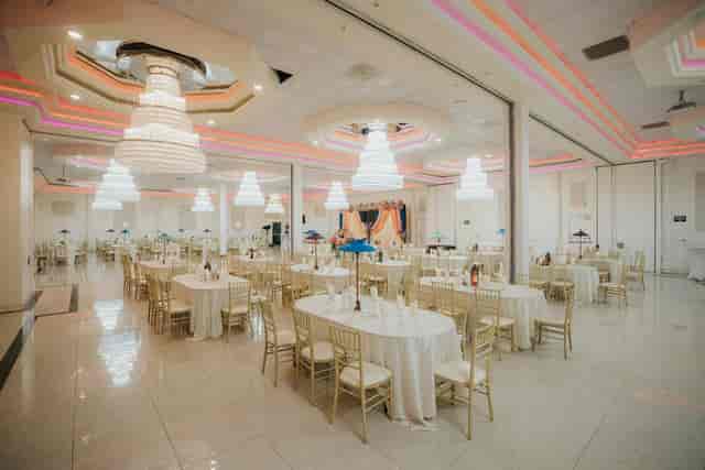 Grand Ballroom at Oasis Palace with elegant chandeliers, perfect for formal events.
