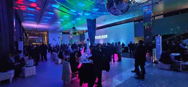 Baccarat Lounge event space with colorful lighting, ideal for networking and presentations.