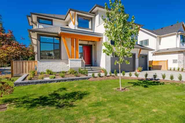 Private garden with vibrant red door, perfect for corporate retreats and gatherings.