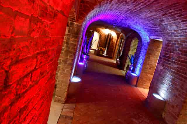 "Cellarz corridor with exposed brick, ideal for networking events and themed gatherings."