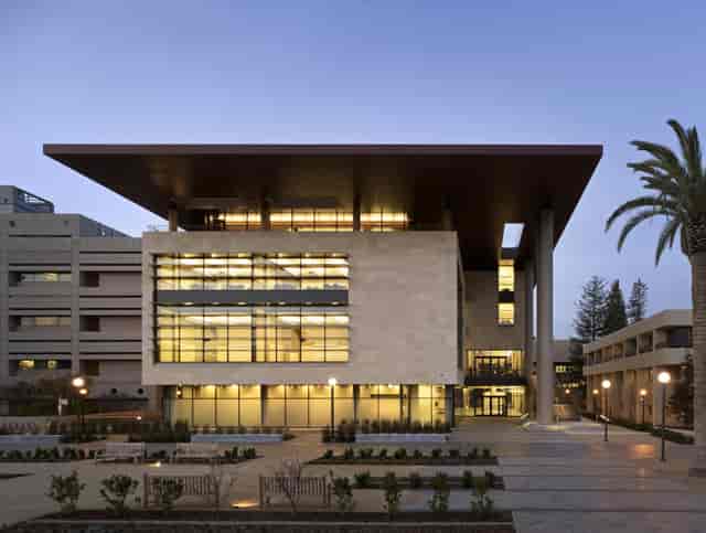 Modern conference center with glass façade, ideal for meetings and corporate events.