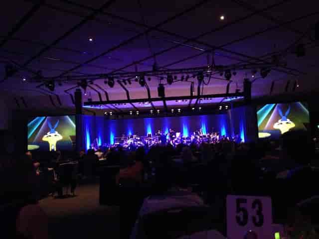 Ballroom stage with vibrant lighting at San Jose Convention Center for gala events.